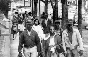 Black people walking down a street